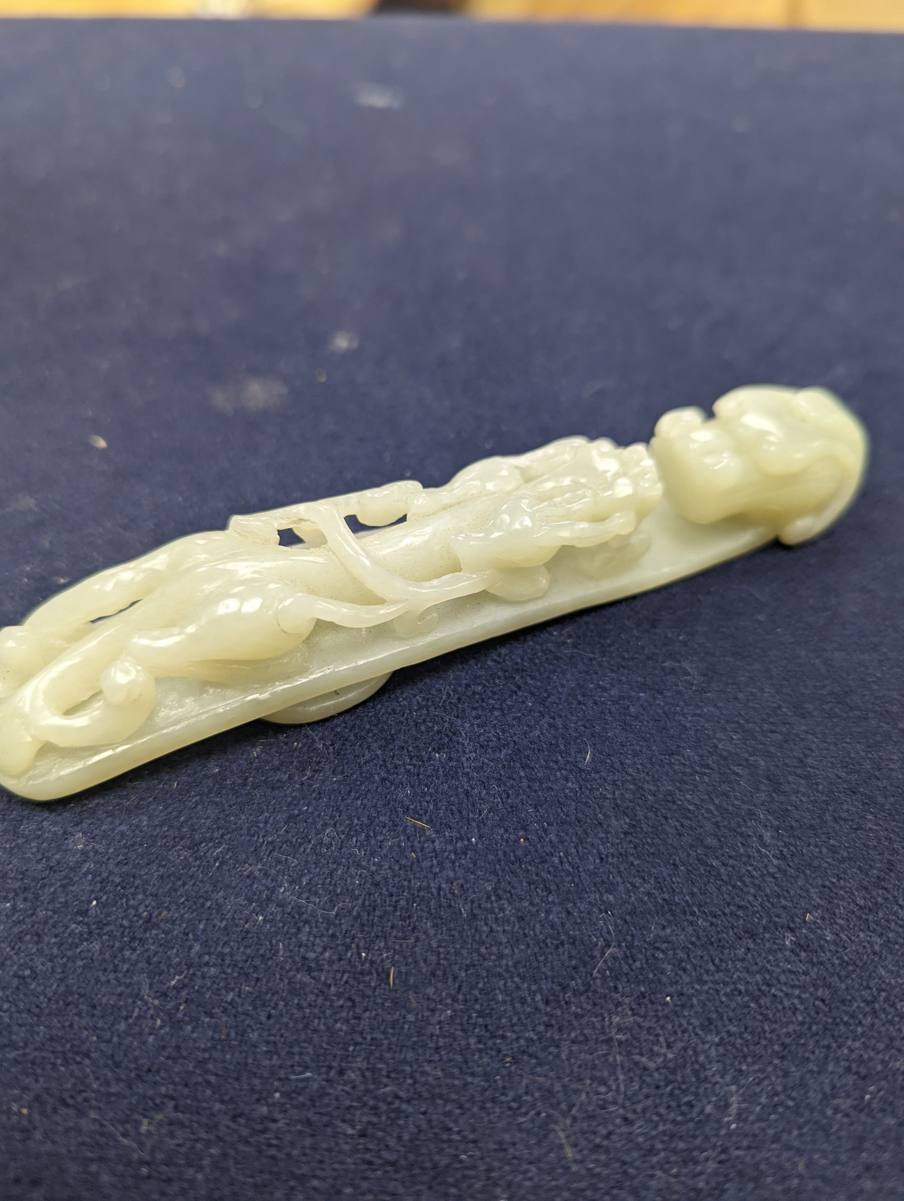 A Chinese jade belt hook, 12.5cm an archer's ring and figure, a stone cup and a glass snuff bottle